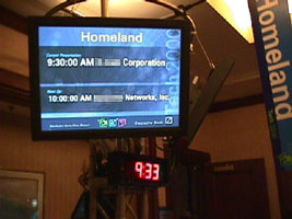 Plasma displays at the entrance to each presentation room showed the name of the current presenter and the name of the presenter to follow.  All information was automatically updated from the backend database.
